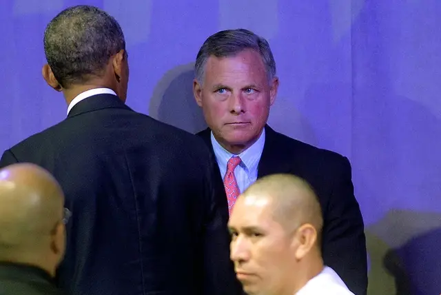 Senator Richard Burr glowers at President Barack Obama following his speech at the American Legion National Convention on August 26, 2014.